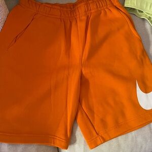 Nike Orange Athletic Shorts with White Logo